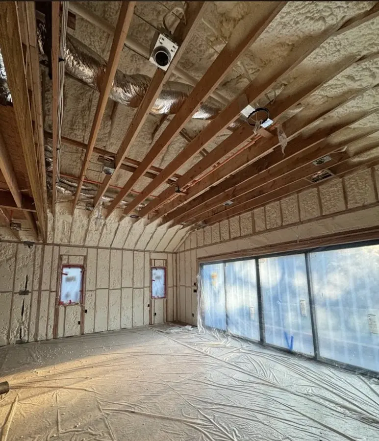 Interior walls and ceiling insulated with spray foam during new construction in Paramus